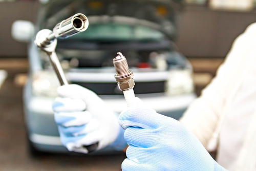 screw the new spark plugs by hand
