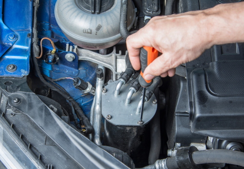 Use a suitable spanner to loosen the fastenings on diesel filter
