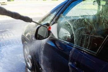 washing the car with detergent